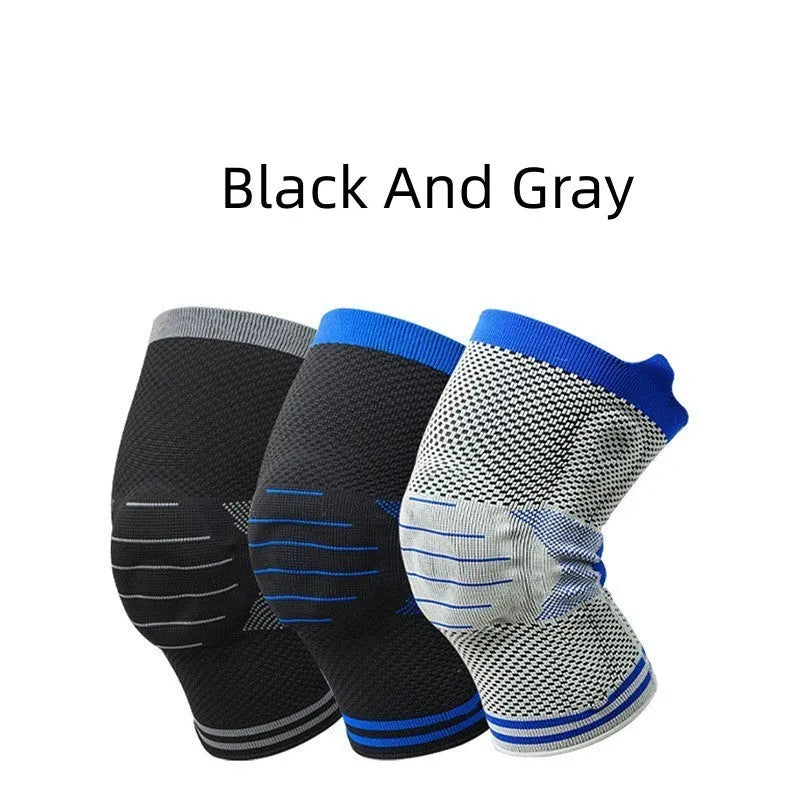A cotton knee pad with a silicone shock absorber, shown in a grey and blue colour combination.