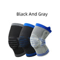 A cotton knee pad with a silicone shock absorber, shown in a grey and blue colour combination.