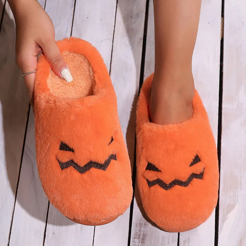 Orange Halloween pumpkin slippers with coral velvet exterior and plush lining