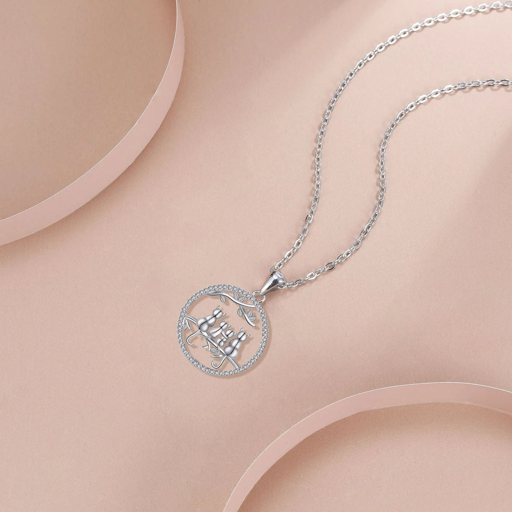 Four kitten pendant necklace on copper cross chain with electroplated finish