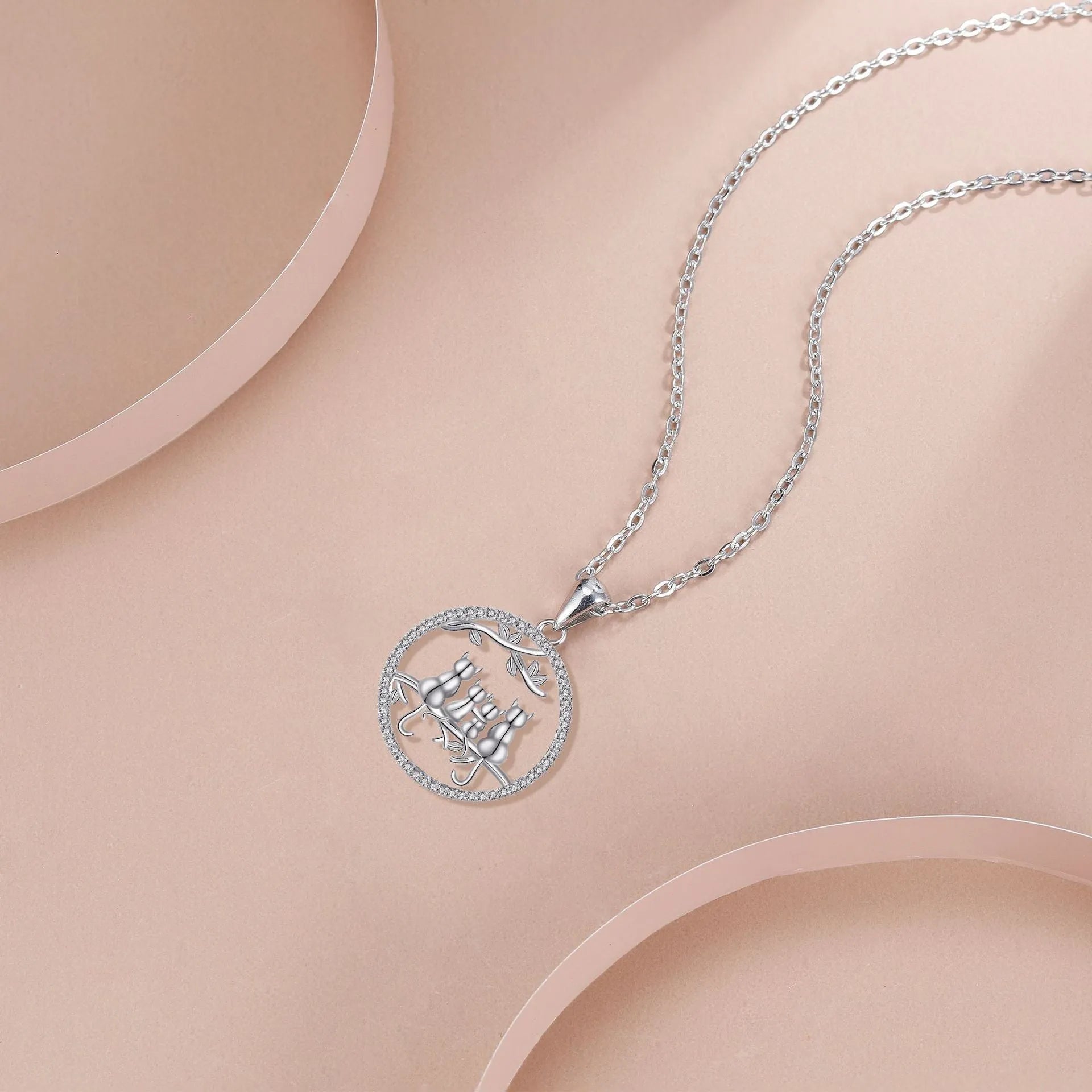 Four kitten pendant necklace on copper cross chain with electroplated finish