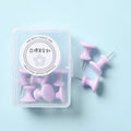 Box of plastic push pins in large and small sizes showing cherry blossom pink, mint green, and lavender colours.