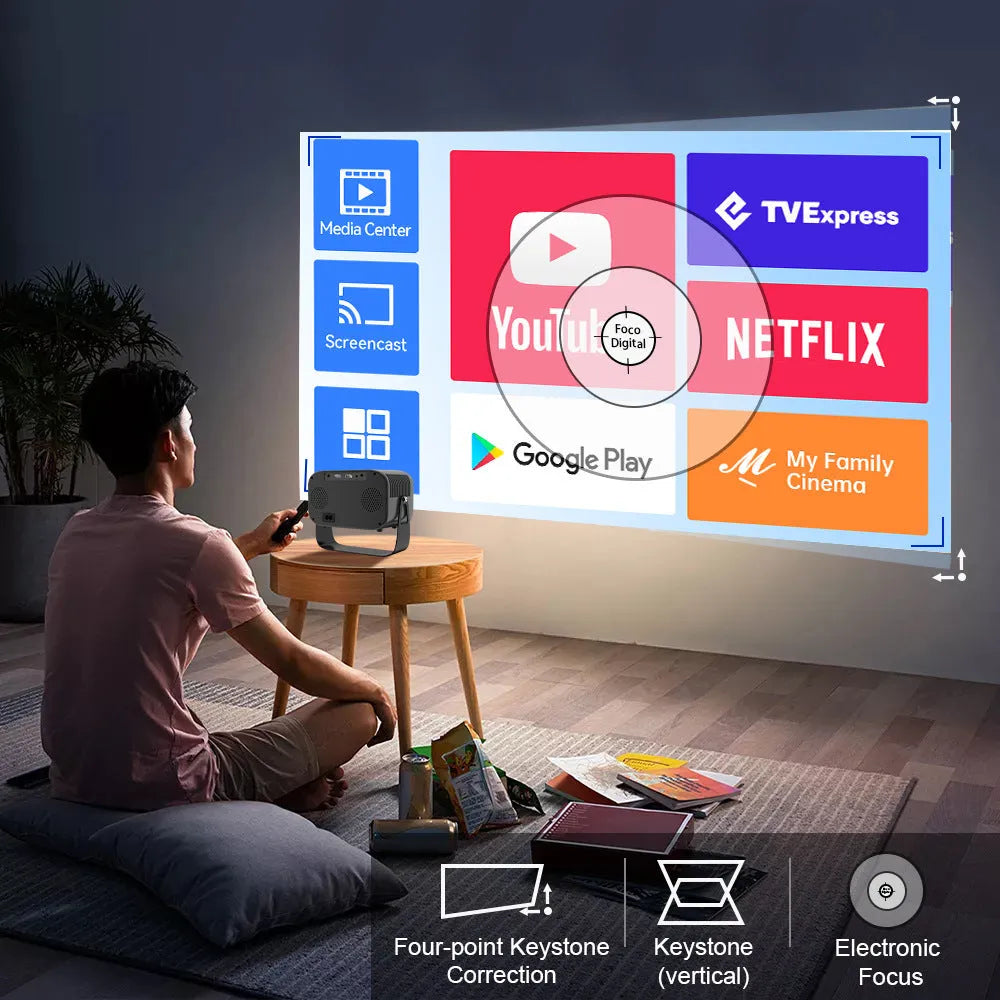 Black HD smart portable projector with remote control on table