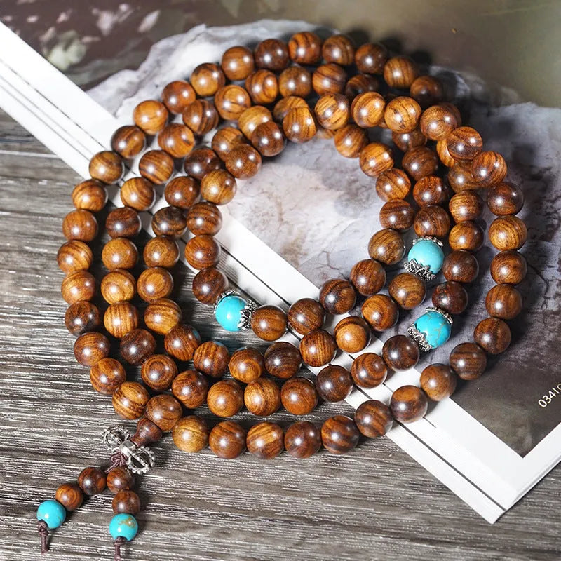 Hand-polished Lvzhu stone bracelet with 108 geometric beads measuring 5-6mm diameter