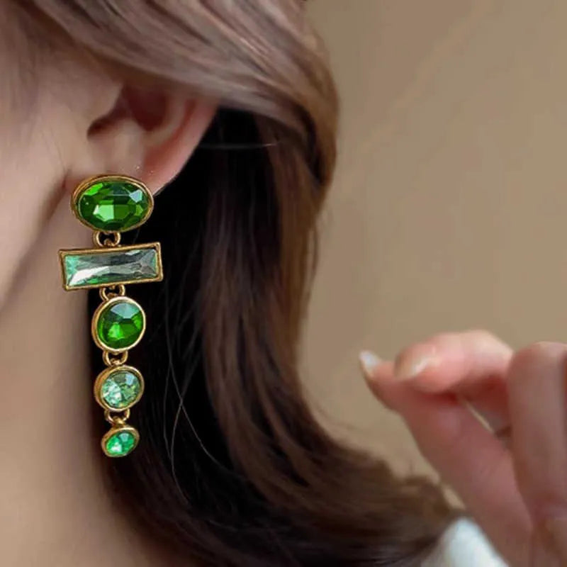A pair of green gradient geometric alloy earrings with a tassel and inlaid zircon stones in a Chinese retro style.