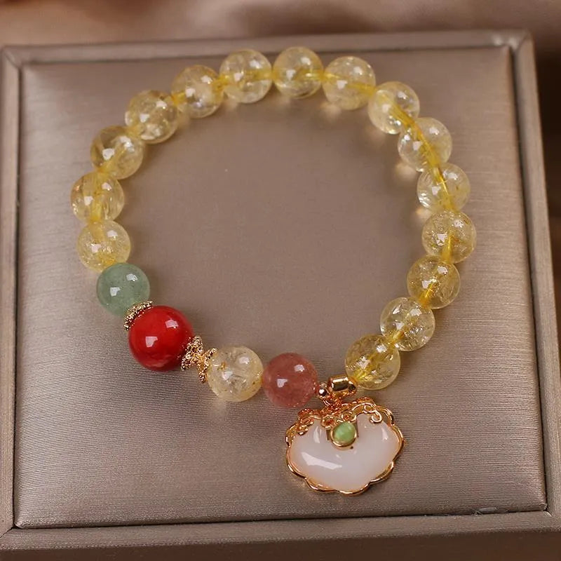 Women's bracelet with a natural yellow citrine jade ruyi pendant on an alloy chain