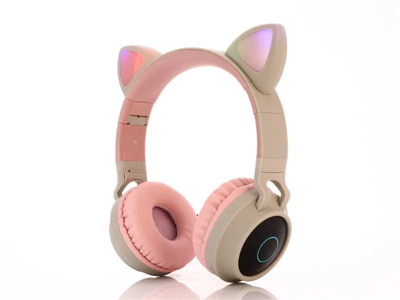 Cartoon-style wireless Bluetooth headset with cat ears on a headband, shown in multiple colour options.