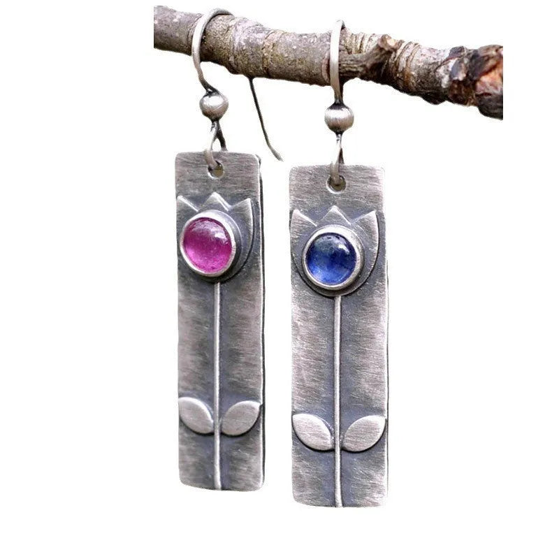 Geometric antique finish earrings with ellipse details and electroplated metal construction