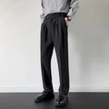 Man wearing straight loose fit suit trousers in apricot colour for formal or office setting