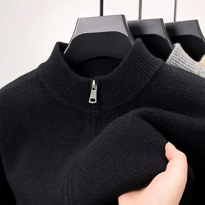 Men's black knitted zip-up cardigan with a stand collar and loose fit.