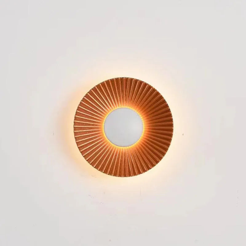 Round aluminium wall lamp with LED lighting in multiple colour variations including gold and white combinations