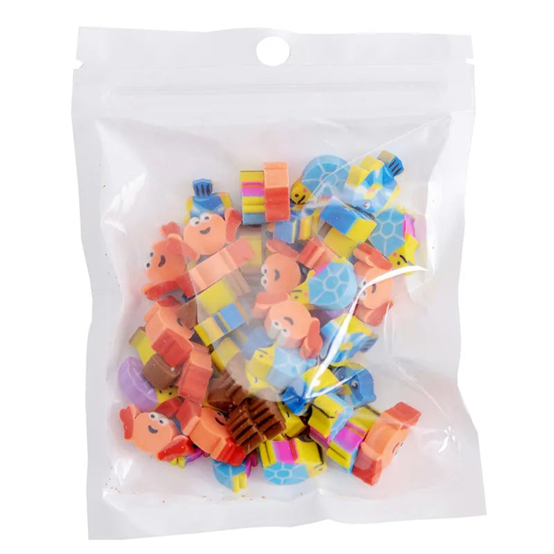 Assortment of colourful TPR cartoon mini erasers showing fruit, animal, and cake designs from a 50-piece pack.