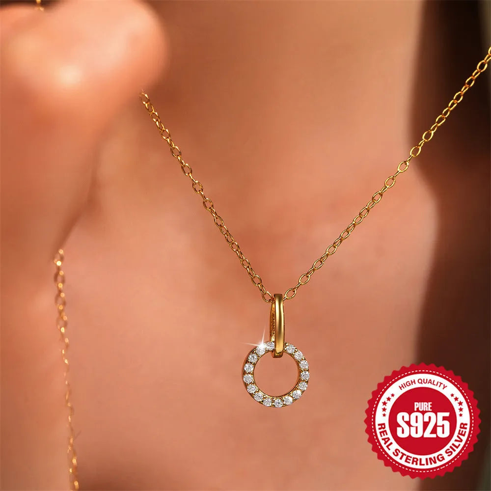 Gold colour S925 sterling silver necklace with geometric interlocking pendant containing micro inlaid zircon stones