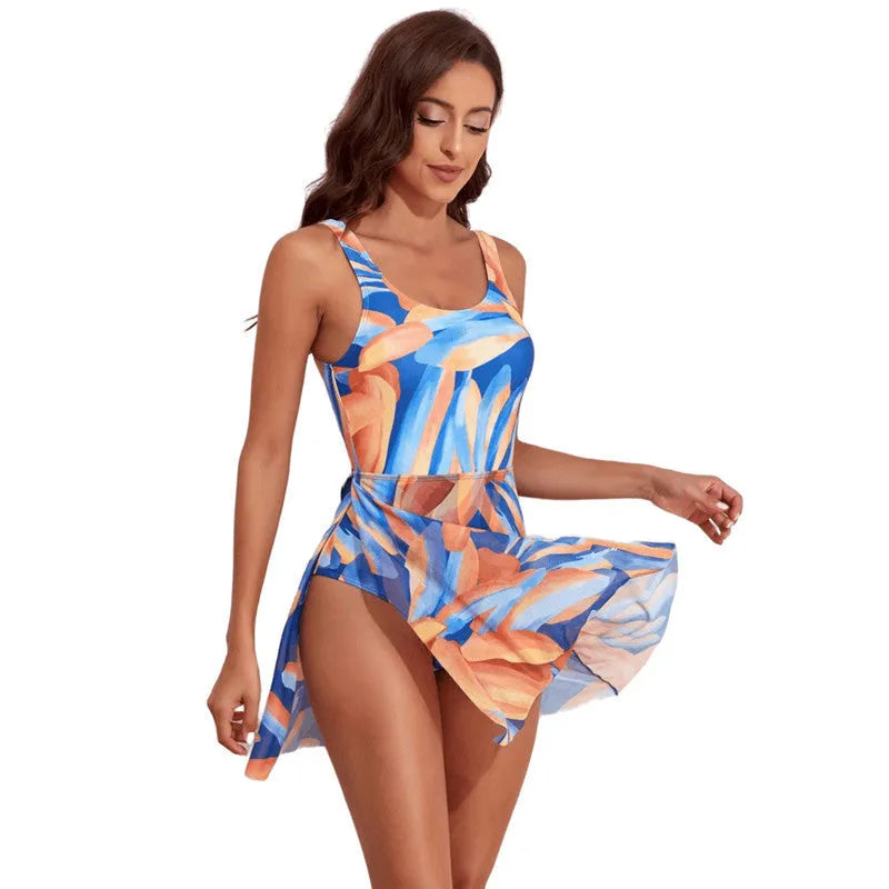 Women's single-shoulder one-piece swimsuit with a floral digital print and slim waist.