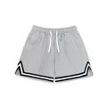 Men's loose fit polyester sports shorts in various colours on a size chart background.