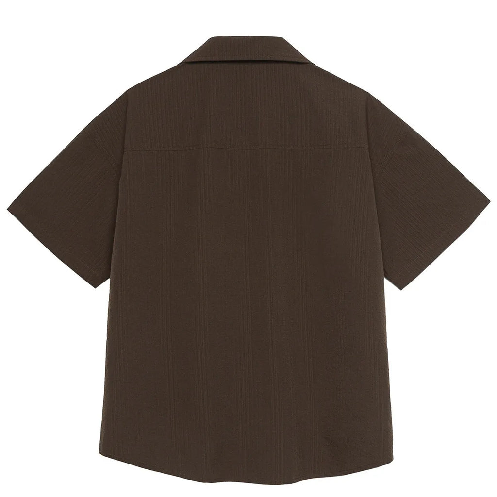 Brown striped short sleeve outdoor shirt with Cuban collar on a mannequin.