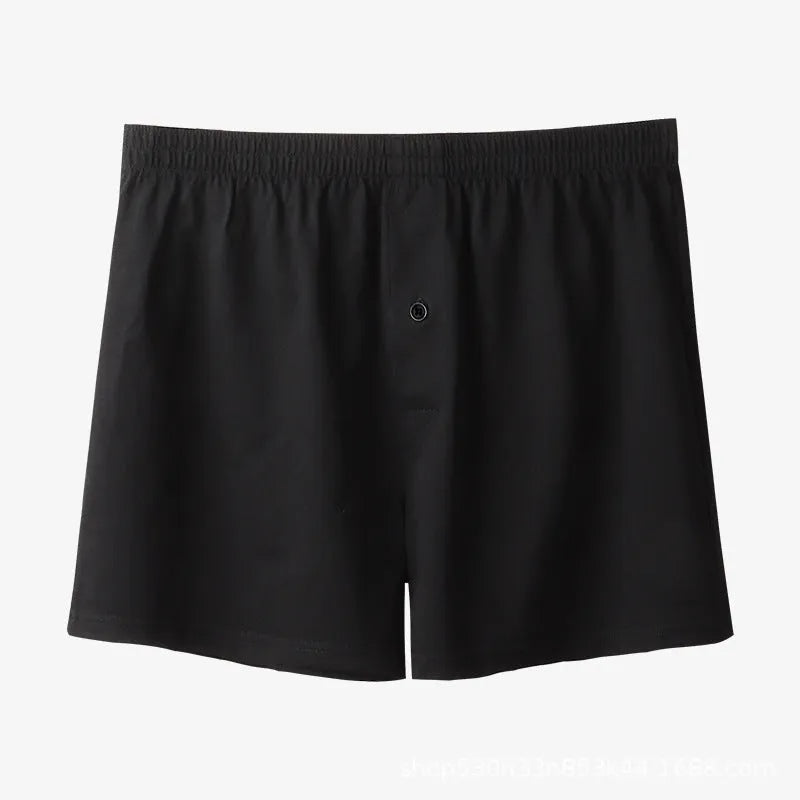 Men's black cotton loose boxer shorts with a high waist on a white background