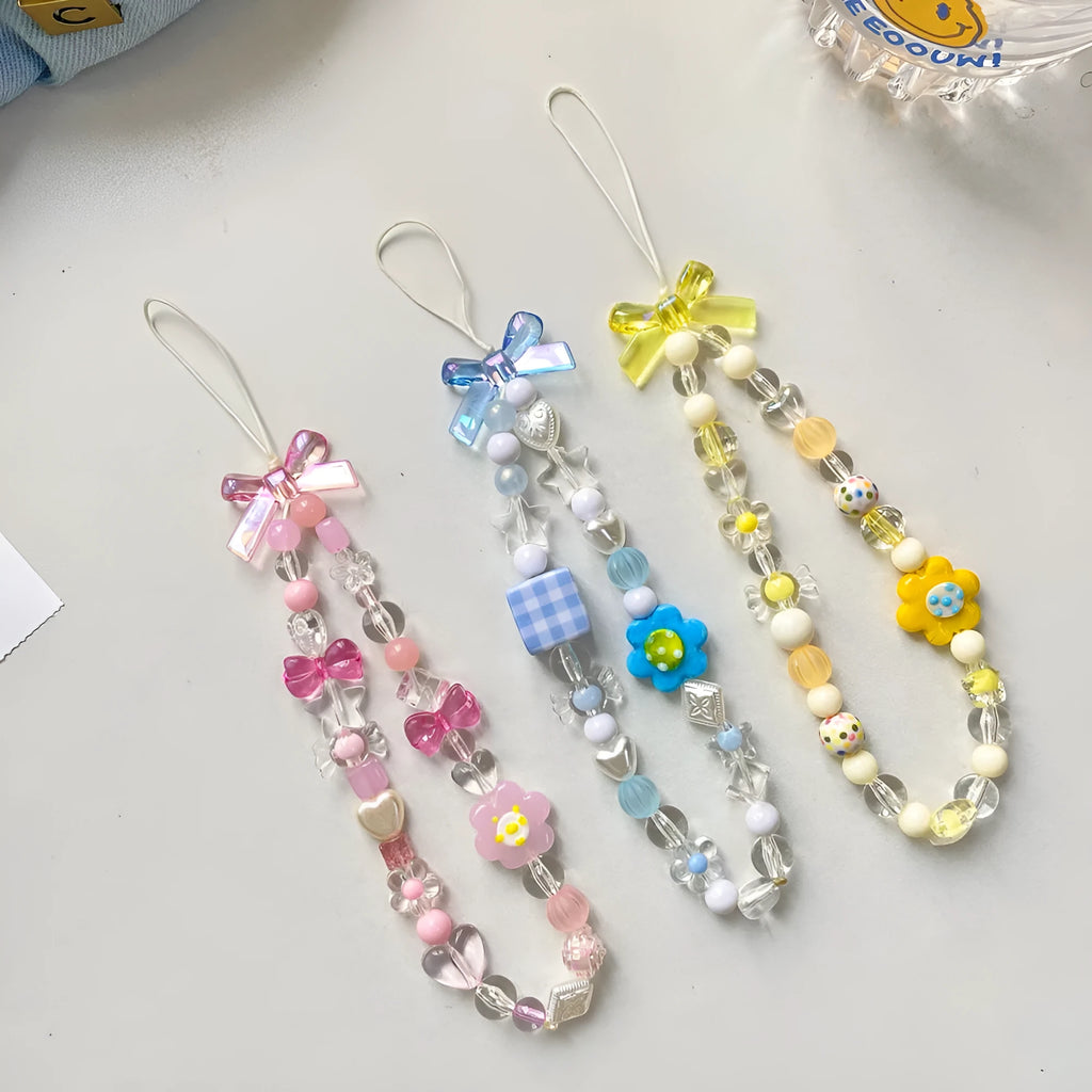 Beaded flower phone lanyard with plastic resin beads on adjustable cord in yellow, blue or pink