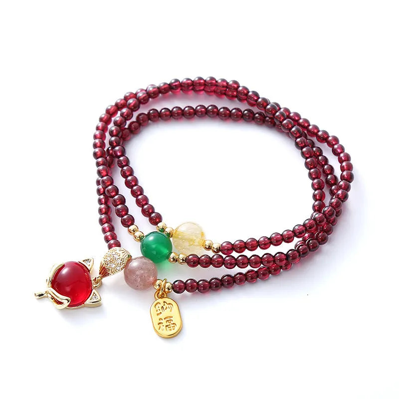 Natural garnet fox bracelet with adjustable rope closure in purplish red colour