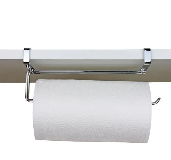Silver stainless steel wire towel rack hanging on a kitchen cabinet door.