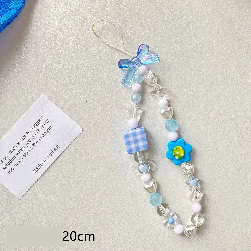 Beaded flower phone lanyard with plastic resin beads on adjustable cord in yellow, blue or pink