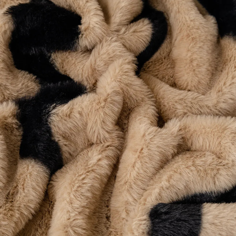 Zebra pattern flannel sofa cover with non-slip backing shown in a caramel colour.