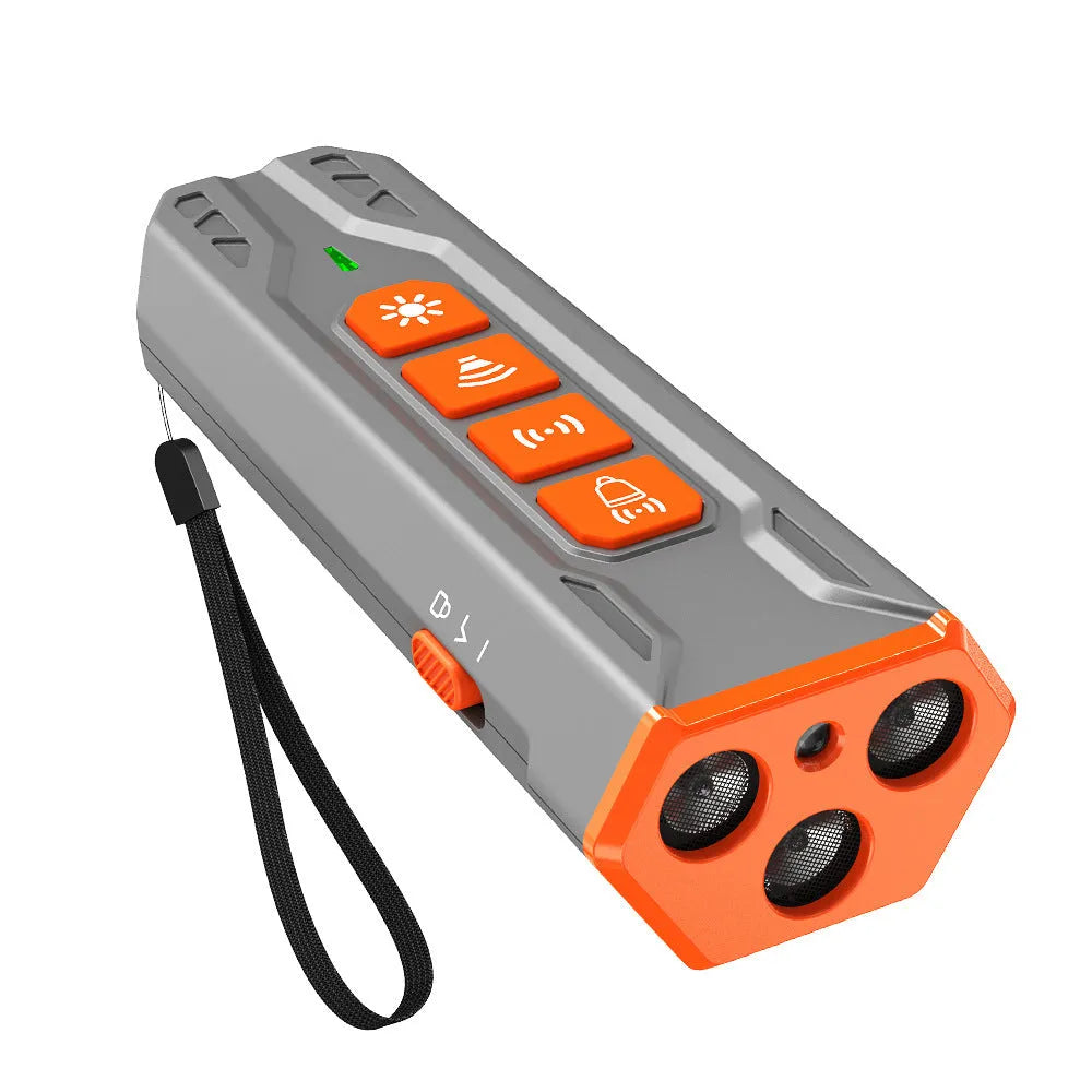 Grey and orange ultrasonic dog trainer device with three adjustable heads for bark control.
