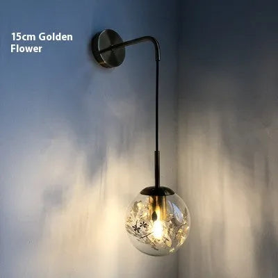 Modern glass wall lamp with minimalist design shown in bedroom setting