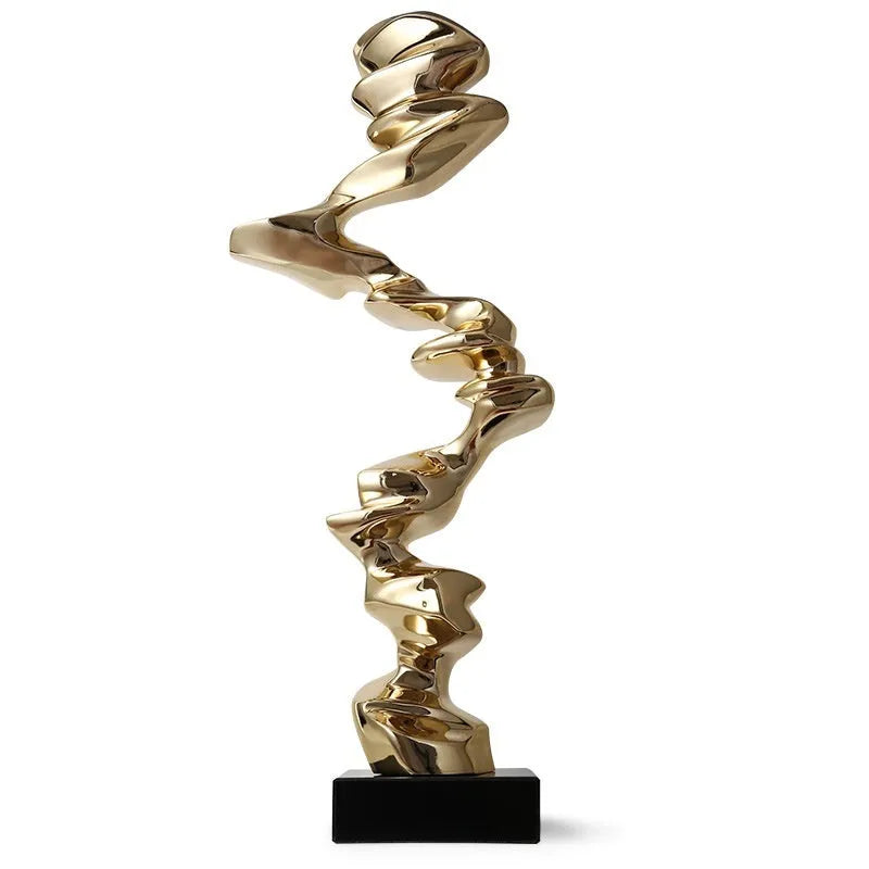 Modern abstract still life sculpture ornament in natural resin on a wooden table.
