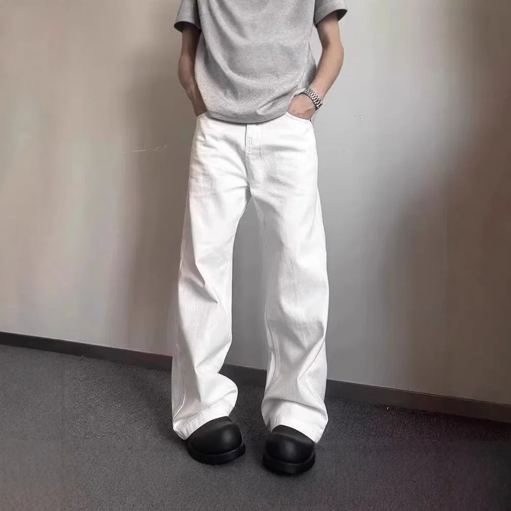 Men's straight leg white cotton denim jeans with wide leg opening and zipper fly