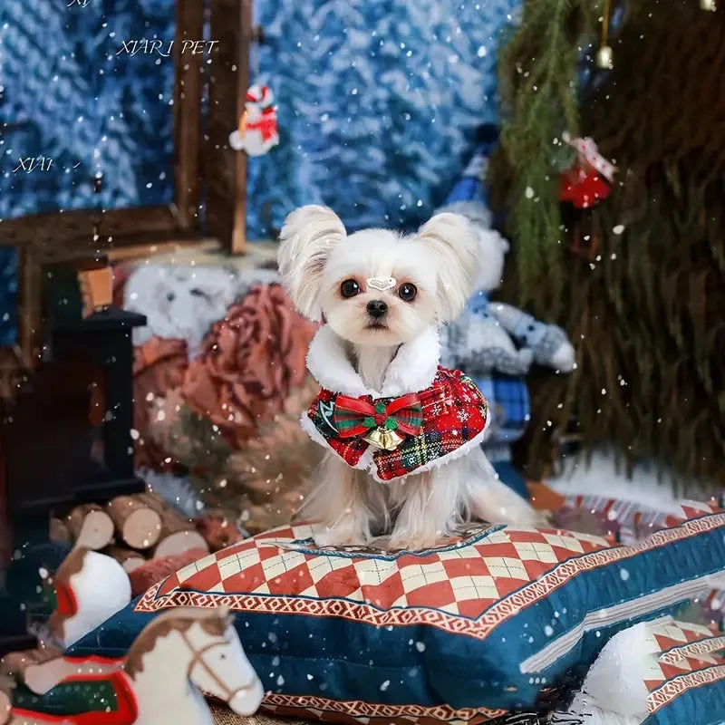 Red polyester pet scarf with snowflake bell design tied around a dog's neck for Christmas