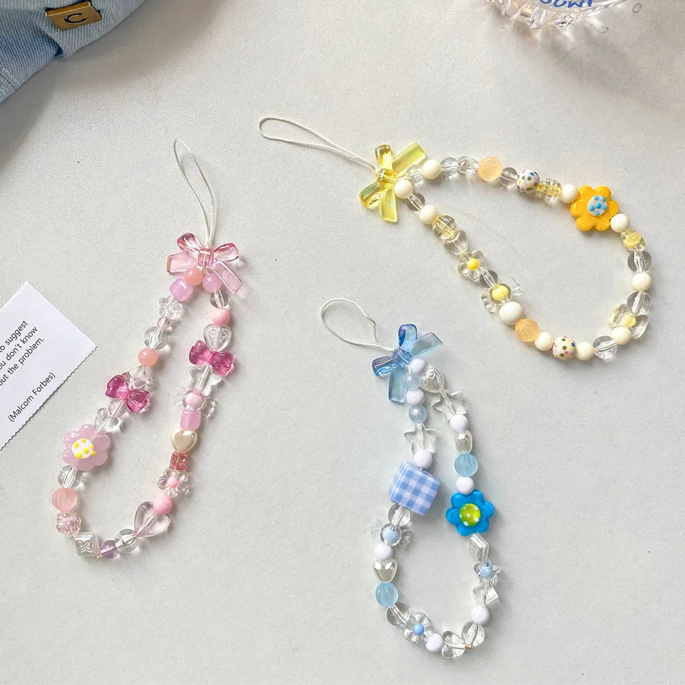 Beaded flower phone lanyard with plastic resin beads on adjustable cord in yellow, blue or pink