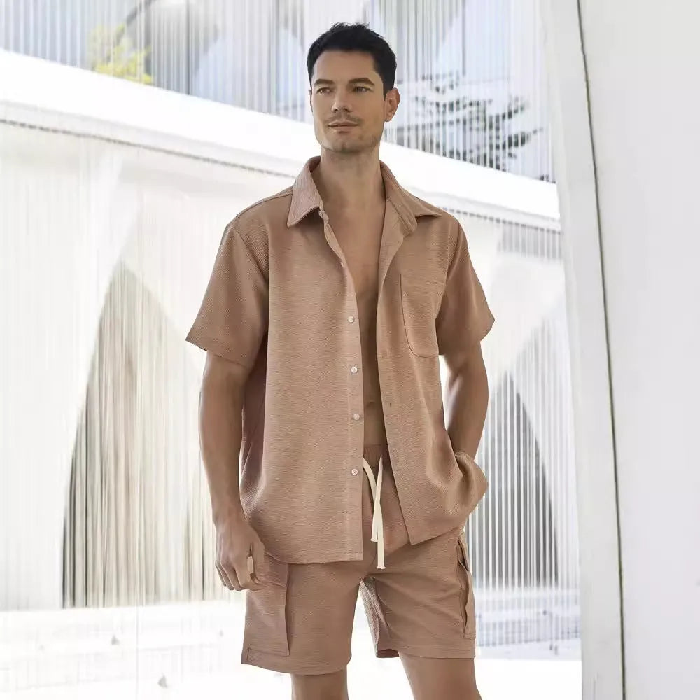 Women's beige polyester two-piece lounge set with short sleeves and elastic waist shorts laid flat.