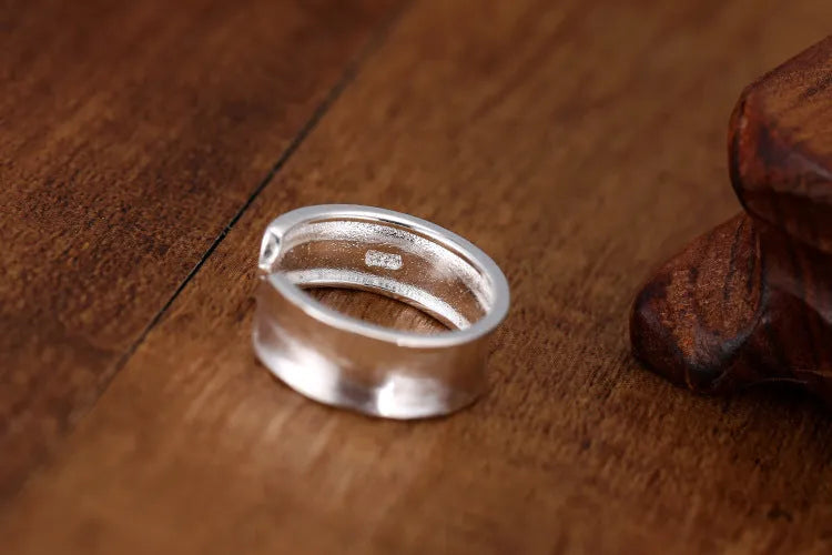 Geometric open ring with frosted sterling silver finish and adjustable opening