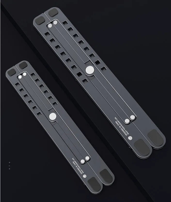 Foldable aluminium laptop stand in silver colour, shown in open and closed positions next to a laptop.