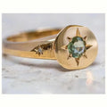 Golden adjustable ring with oval face featuring detailed star inlay design