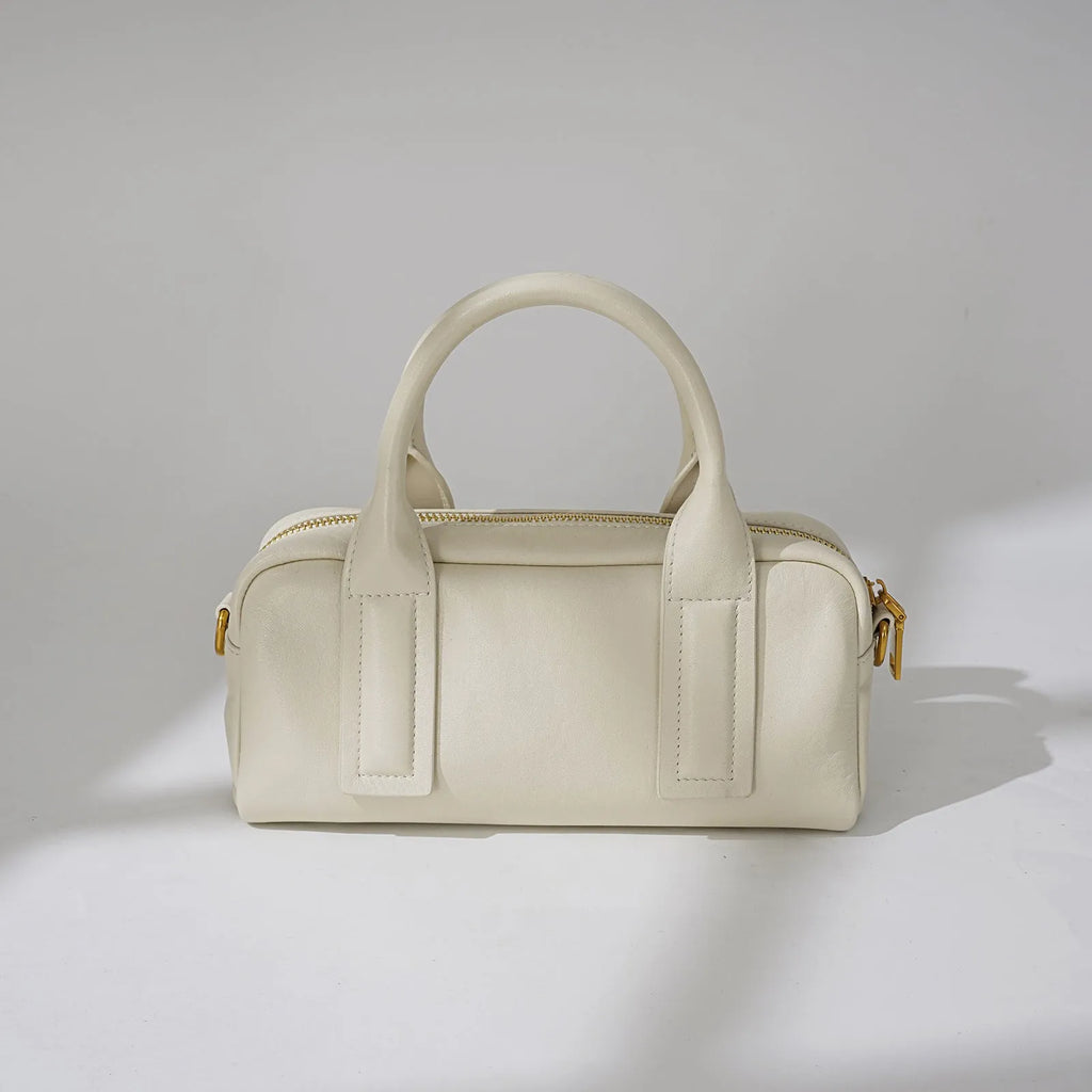 Genuine first layer cowhide crossbody bag in horizontal square shape with external sandwich pocket, available in black, brown, or milkshake white