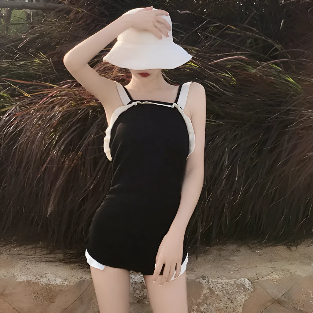 Conservative one-piece swimsuit for women in nylon fabric with modest coverage and traditional styling