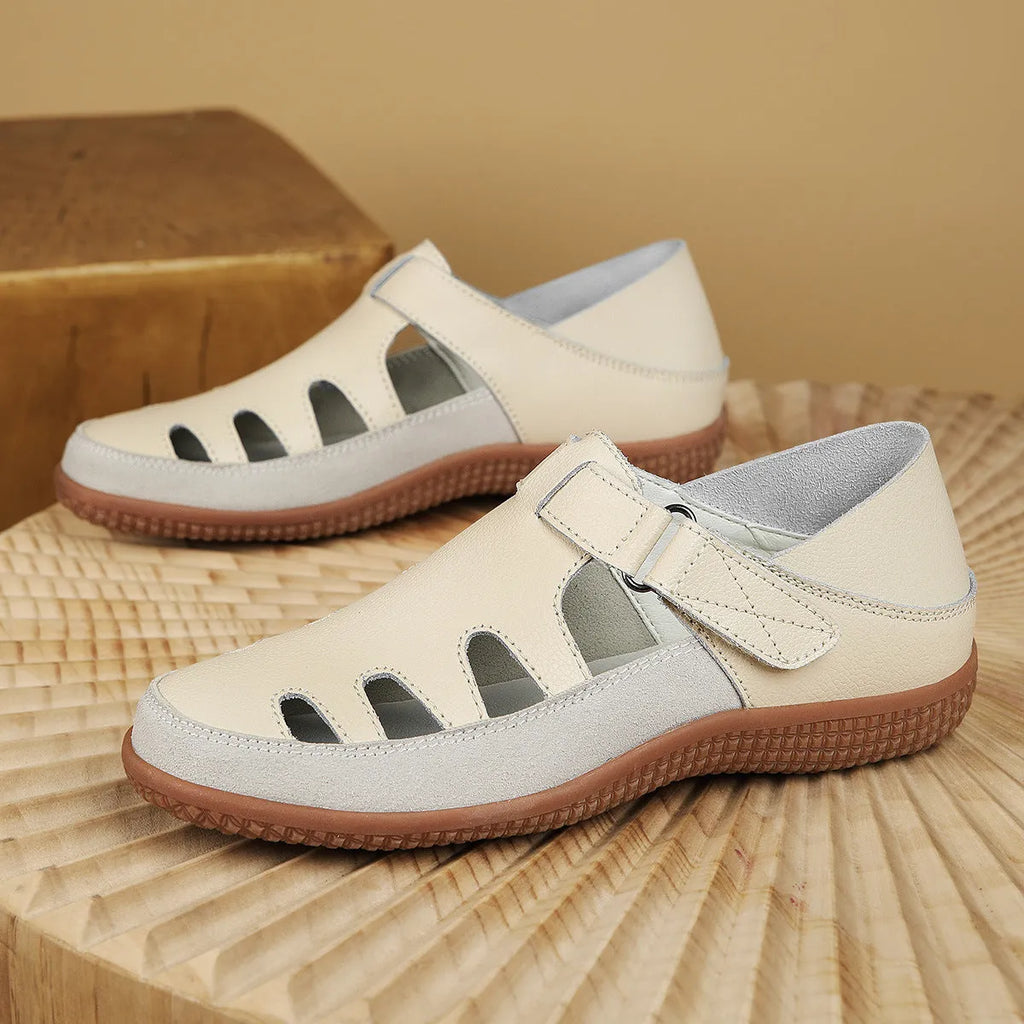 Women's plus size flat sandals with hollow out toe cap in blue, red, or white on thick rubber sole.