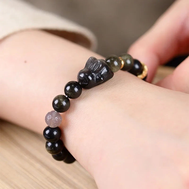Handmade lying rabbit charm obsidian bracelet in Jin Yaoshi with gray agate details, national style unisex jewellery.