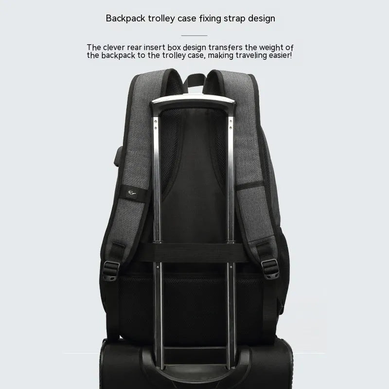 Grey nylon backpack with USB charging port and trolley strap on luggage