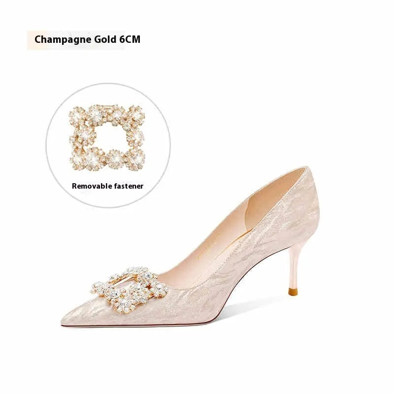 Champagne gold women's high heel pumps with pointed toe, stiletto heel, and rhinestone decoration.
