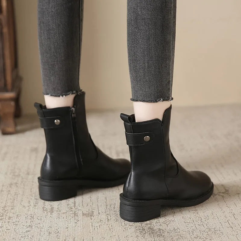 Black women's ankle boots with side zipper and low heel on round toe