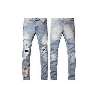 Black slim fit skinny jeans on a man, showing straight leg cut and manual distressing details.