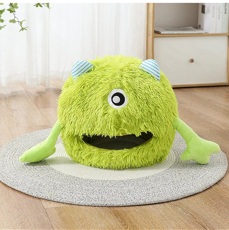 A round fluffy pet bed for cats and small dogs on a wooden floor.