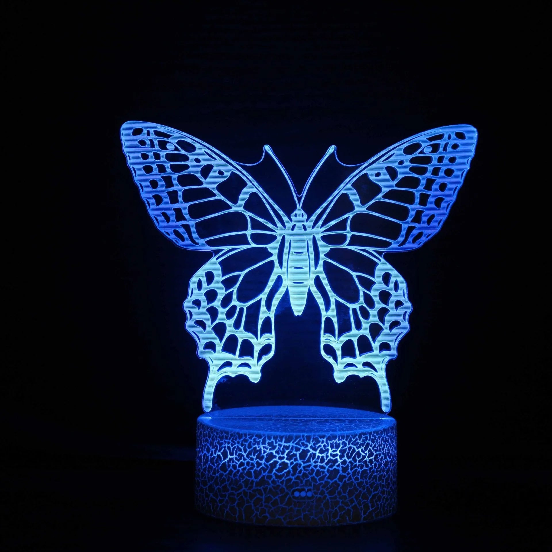 Acrylic 3D colourful touch USB table lamp with crack base design and LED light on a desk.