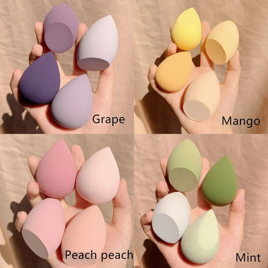 Makeup egg box with four coloured synthetic sponge beauty blenders, each roughly 6cm in size.