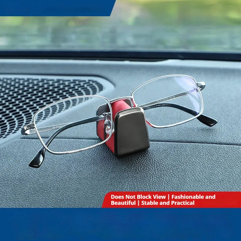Zinc alloy and leather car dashboard clip for holding sunglasses, shown in green colour.