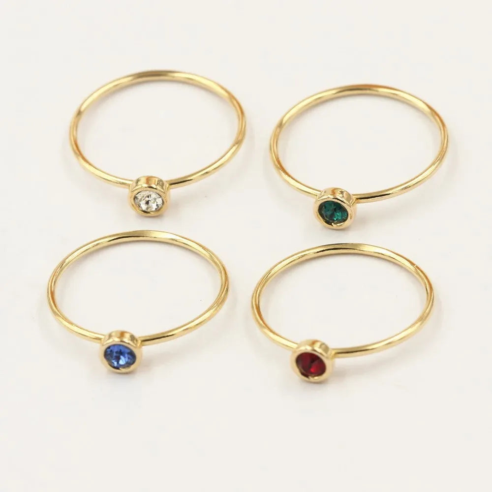 Women's 14K gilded copper knuckle ring with green cubic zirconia stone in US size 7.