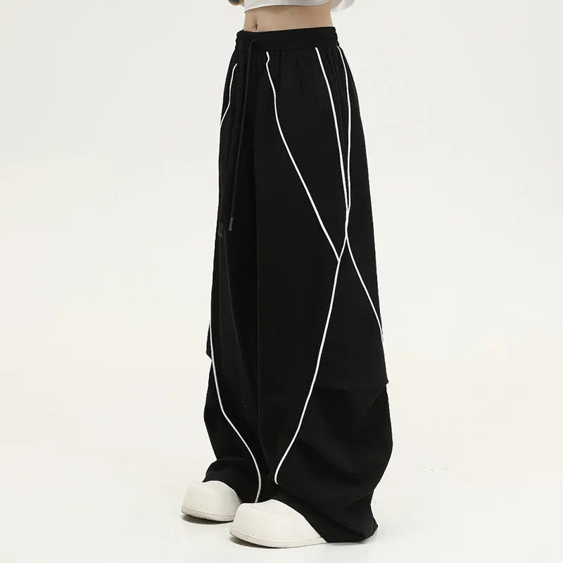 Black pleated wide-leg trousers with striped pattern for hip hop dance and streetwear